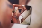 Rihanna Shows Off Her Pert Derriere in a Tiny Snakeskin Bikini
