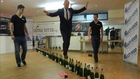 Guinness World Records: Most upright bottles walked across
